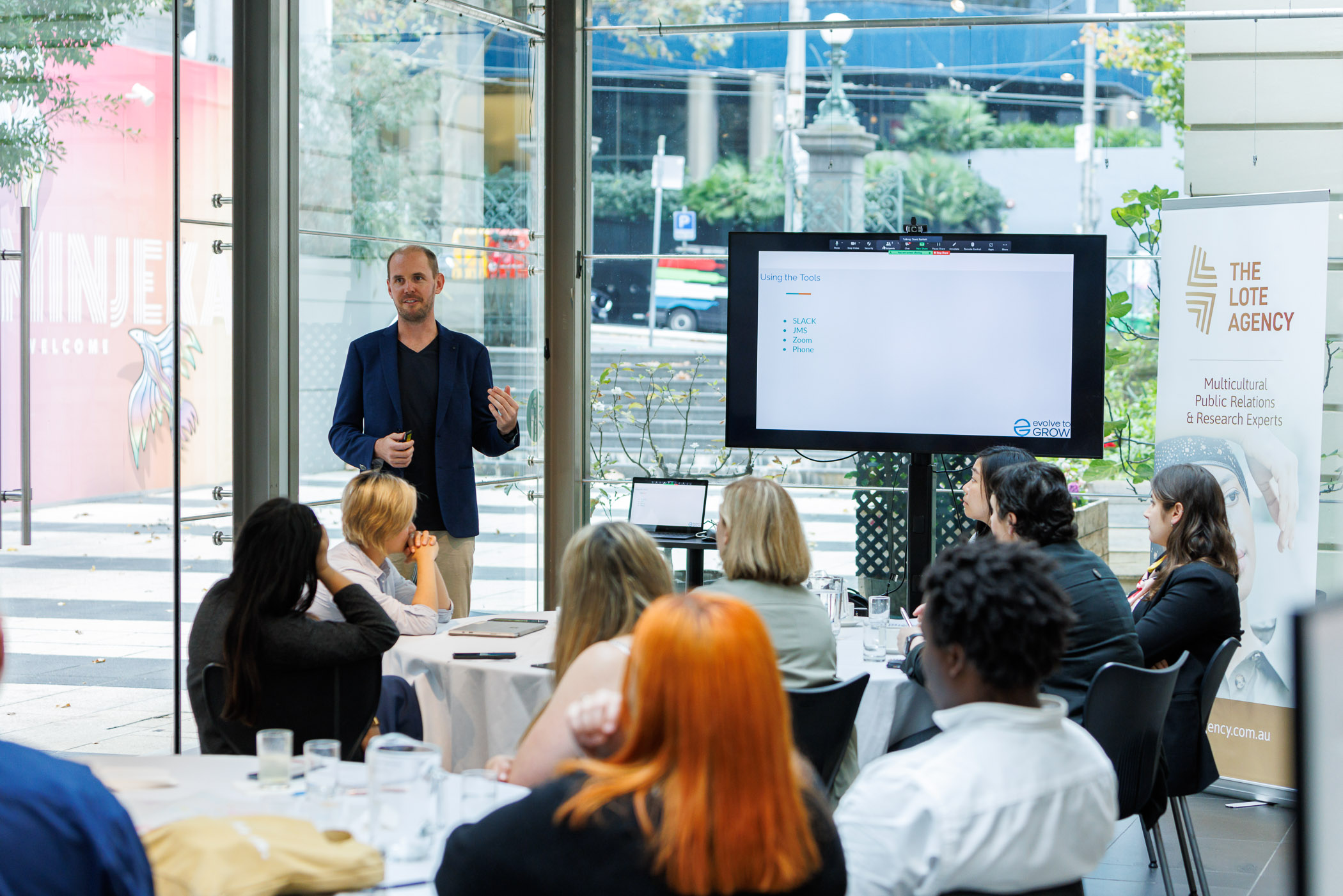 Wide room shot of Tristan Wright speaking at The LOTE Agency event